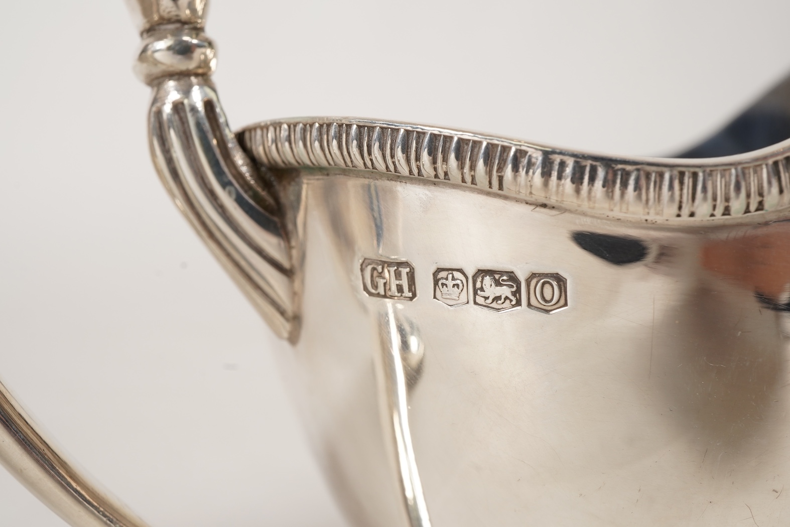 A pair of George V silver pedestal sauce boats, by Howson Brothers